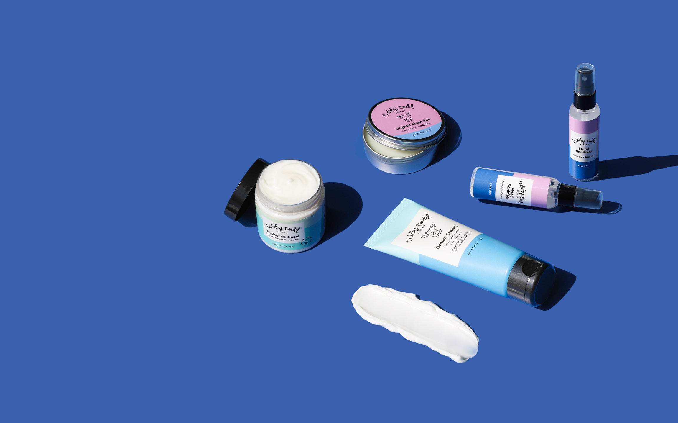 Collection of winter bundle skincare products on a blue background